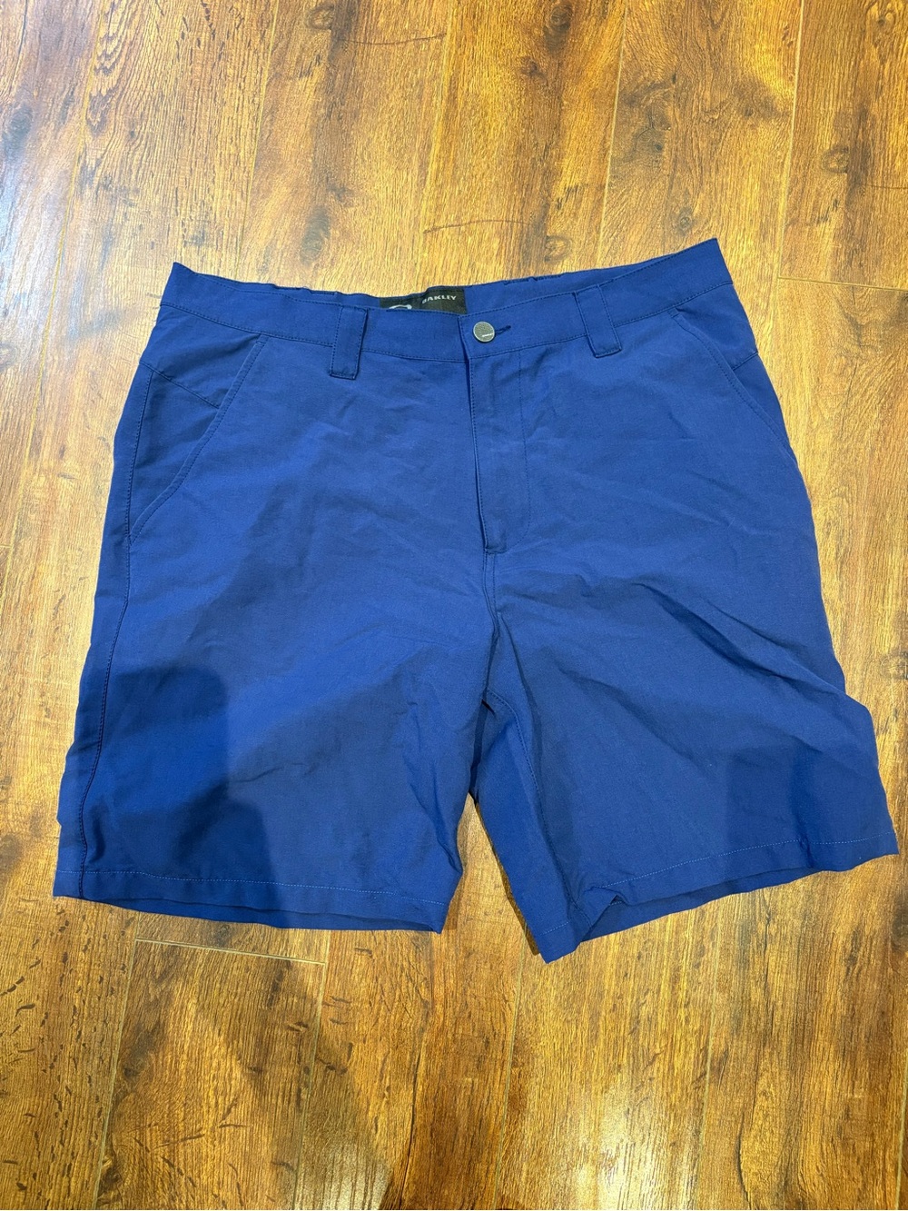Oakley Men's Flat Front Shorts in Blue